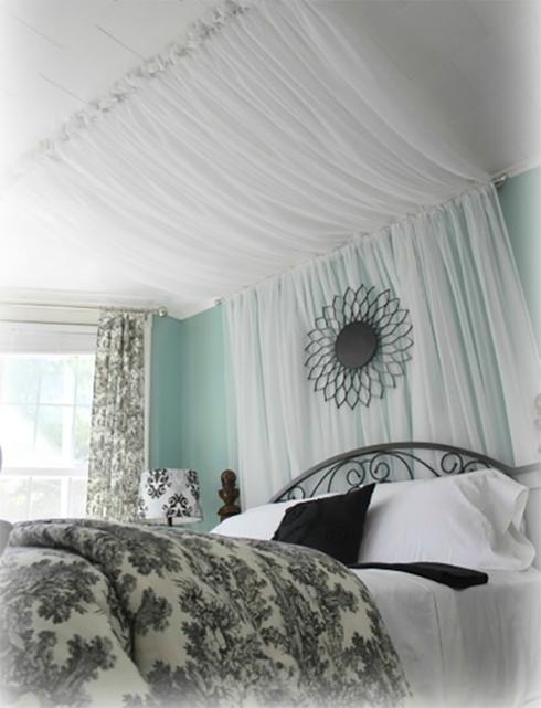 canopy bed with white veils