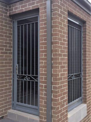 Brick building with two metal security doors.